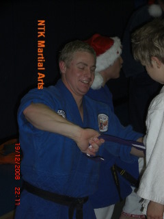 Sensei Scott just loves tying new belts!